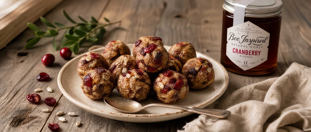 plate of cranberry bliss balls with cranberry honey