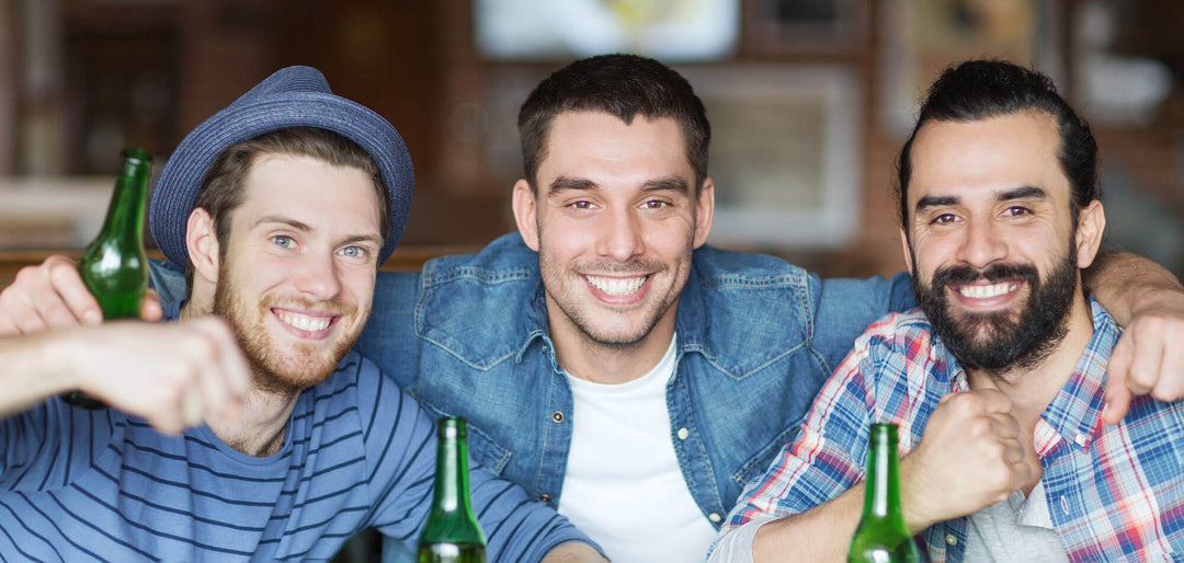 A group of three men, smiling at the camera