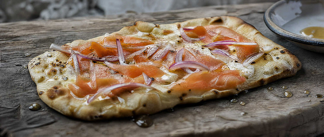 smoked salmon pizza on wood