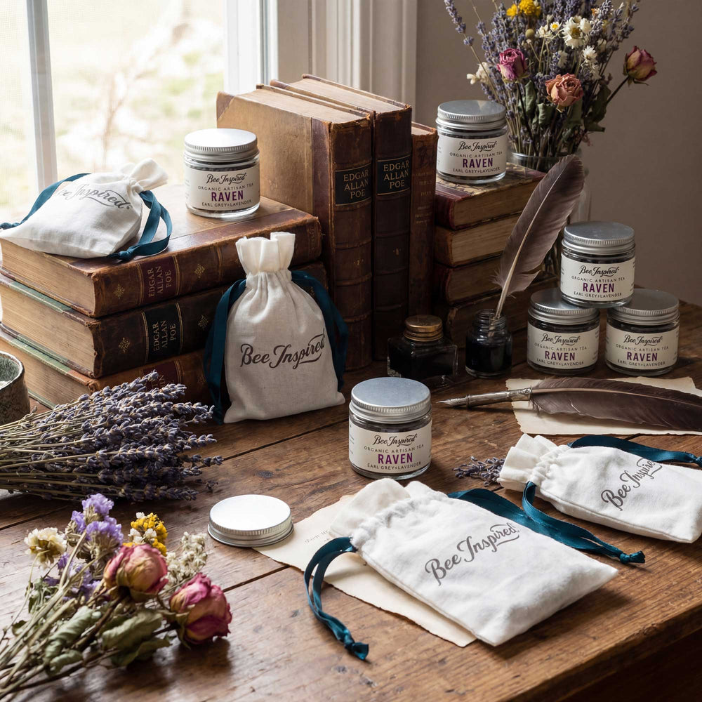 Bee Inspired products on a wooden surface with books and flowers