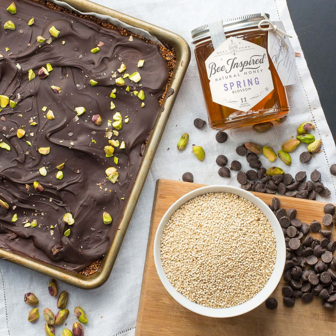 Tray of honey pistachio chocolate bark with Spring honey from bee inspired honey retail store in owings mills, pistachios, and chocolate chips 