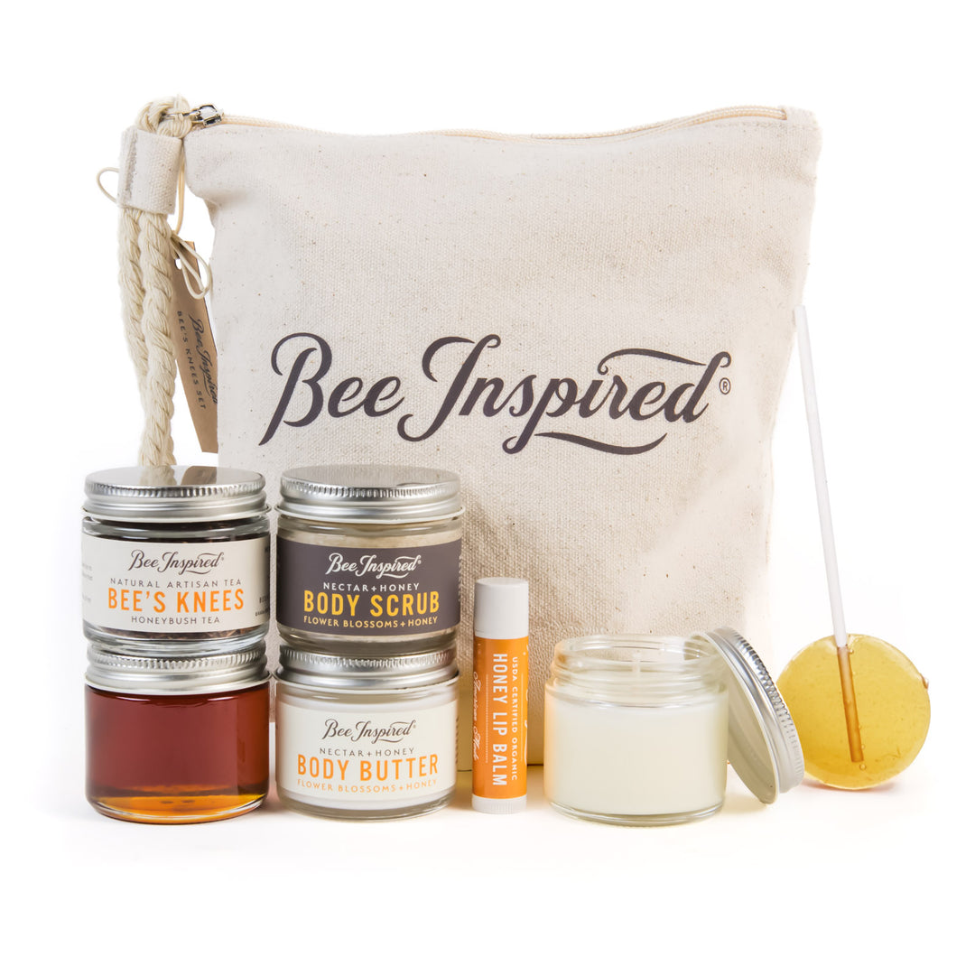 Bee Inspired skincare and body care products with a canvas bag on a white background