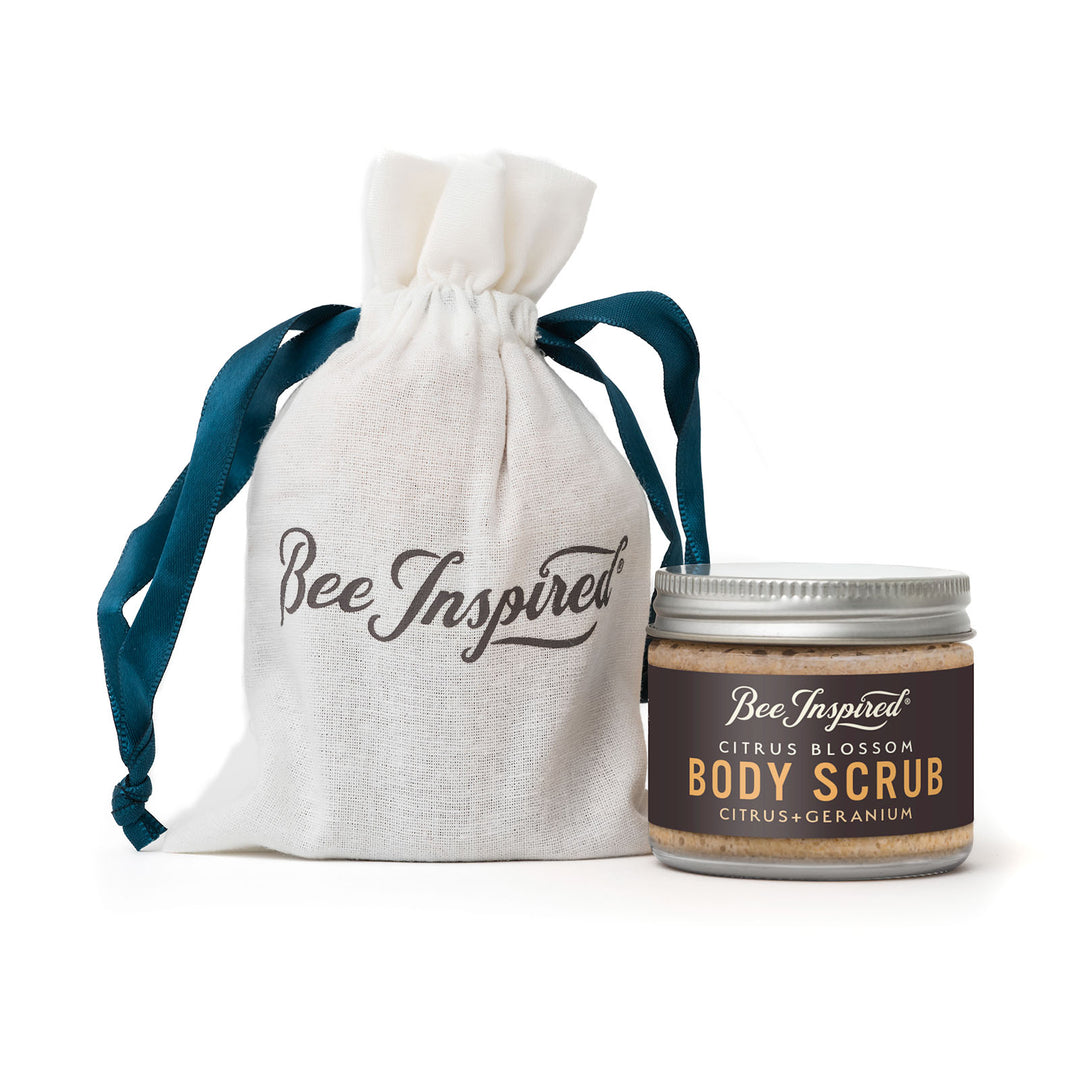 Citrus Blossom Body scrub party favor jar with 'Bee Inspired' drawstring bag on a white background