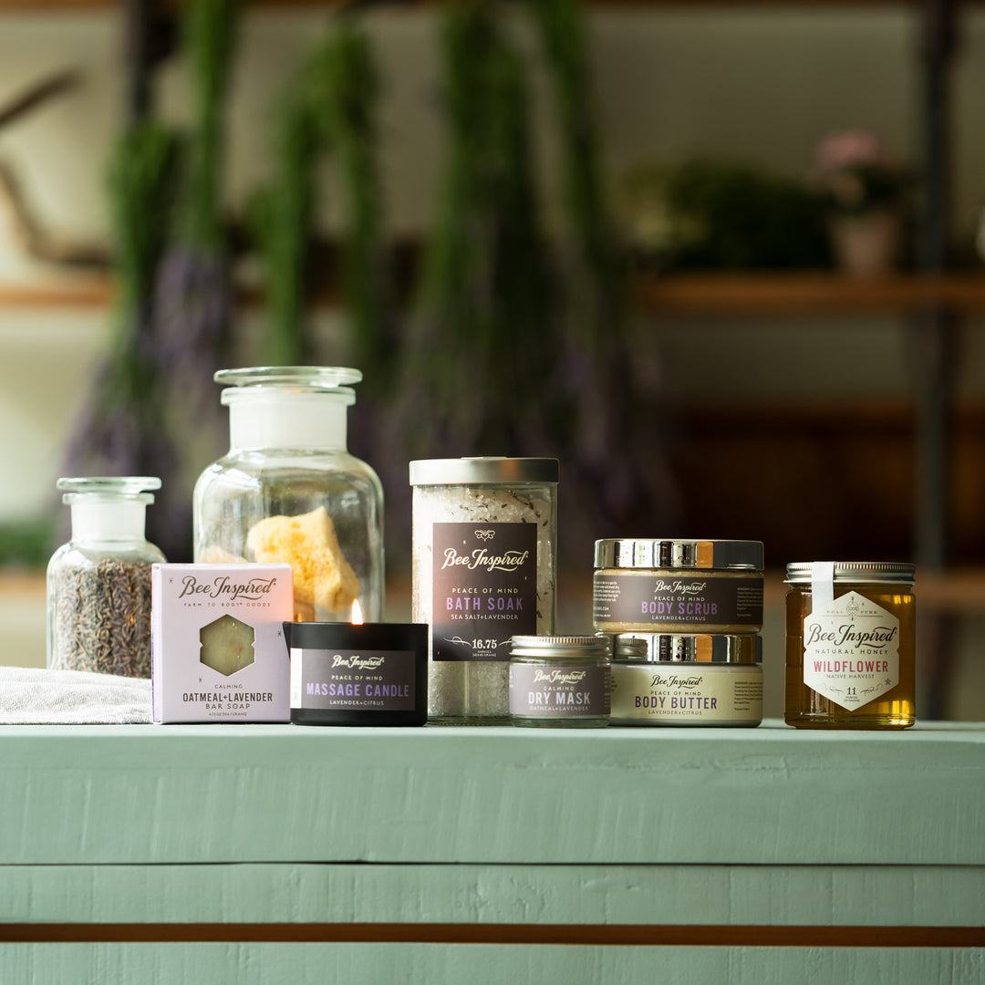 Lavender Experience gift set with drying lavender bunches in the background 