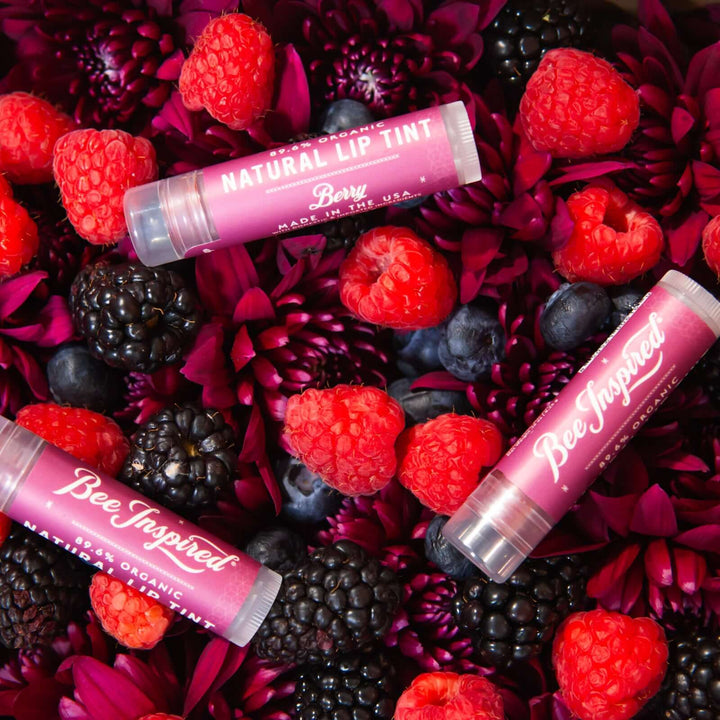 Berry lip tints on raspberries, blackberries, and blueberries 