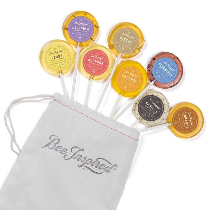 Assorted lollipops with visible flavors and a &
