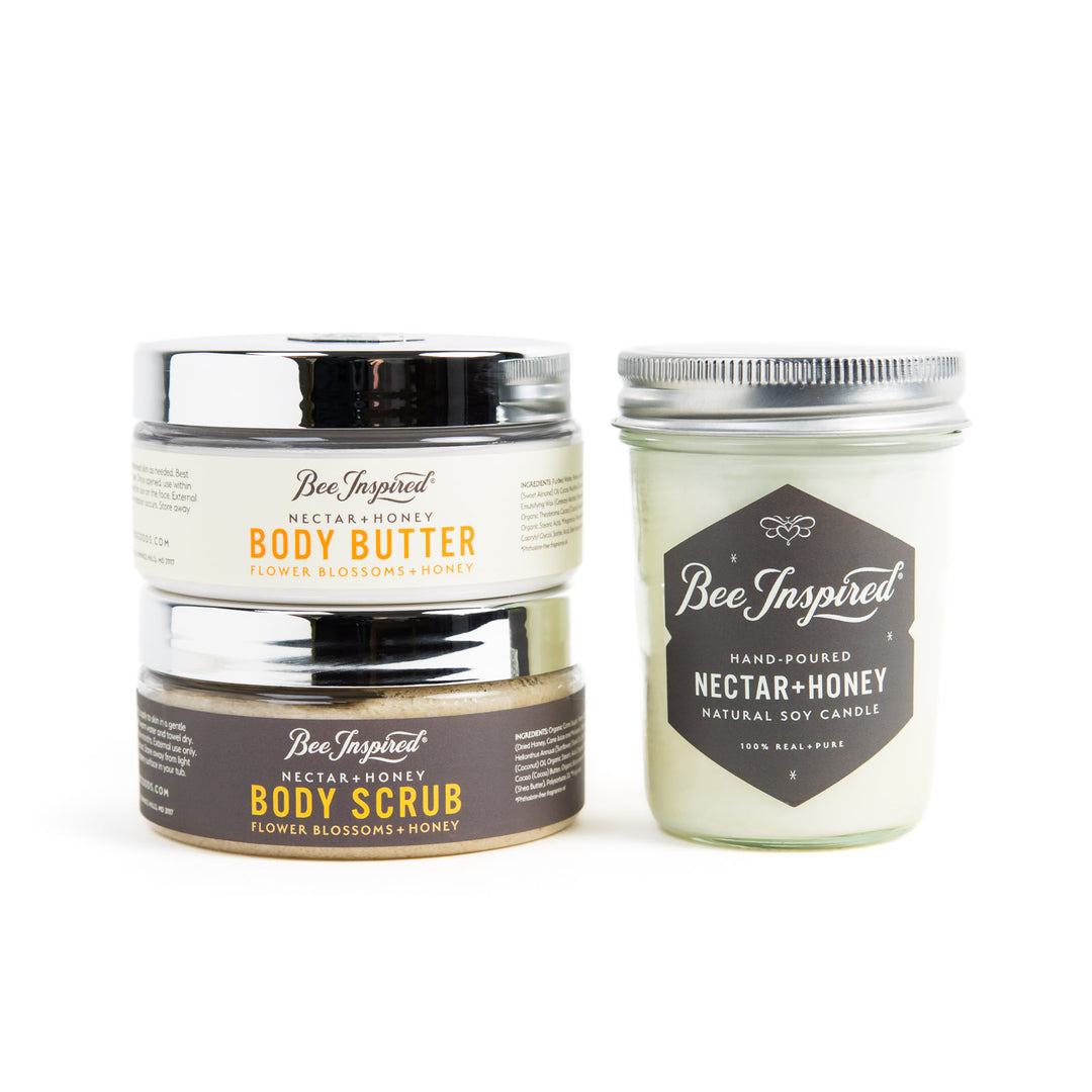'Bee Inspired' Body Butter, Scrub, Nectar + Honey Candle products on a white background