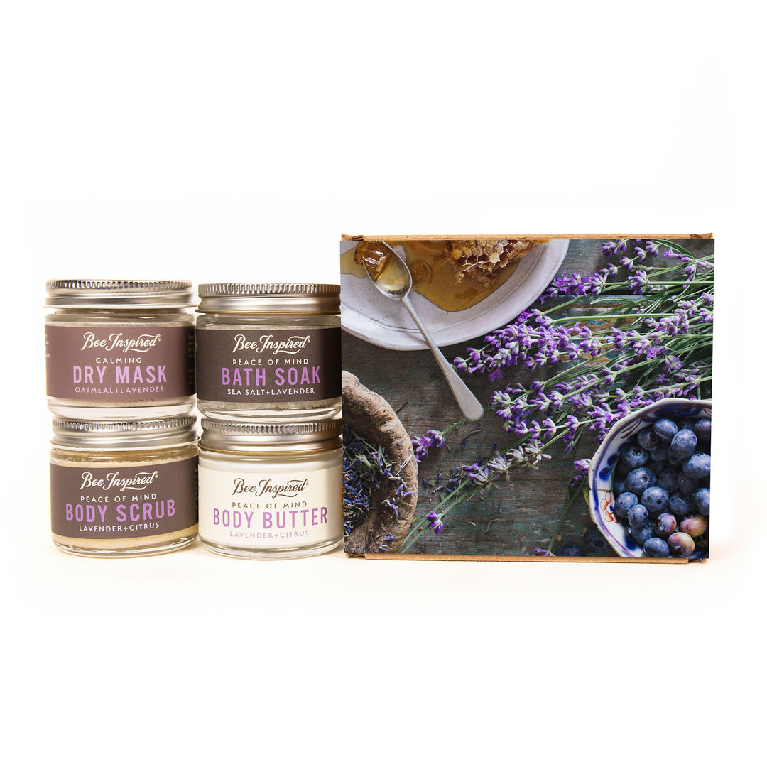 Set of skincare products with a decorative box featuring lavender and blueberries.