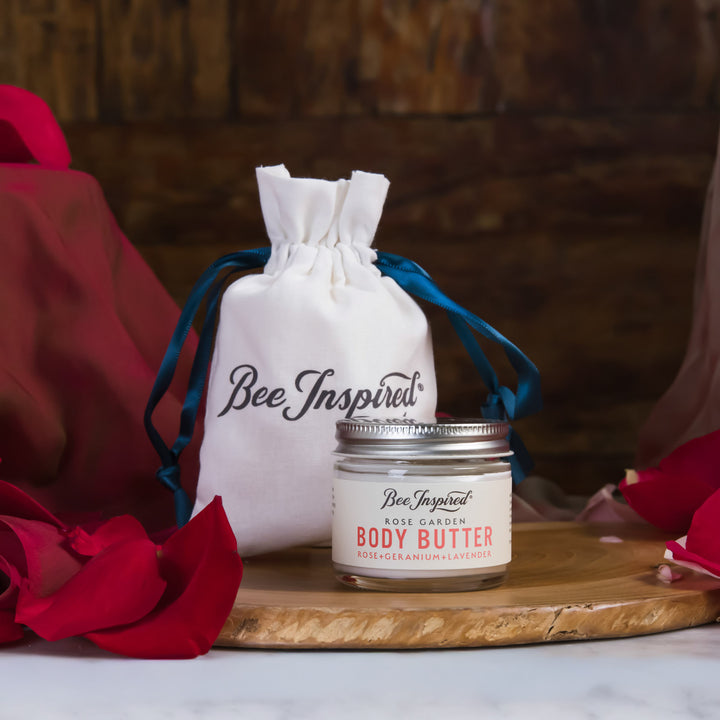 Jar of body butter with a drawstring bag labeled &