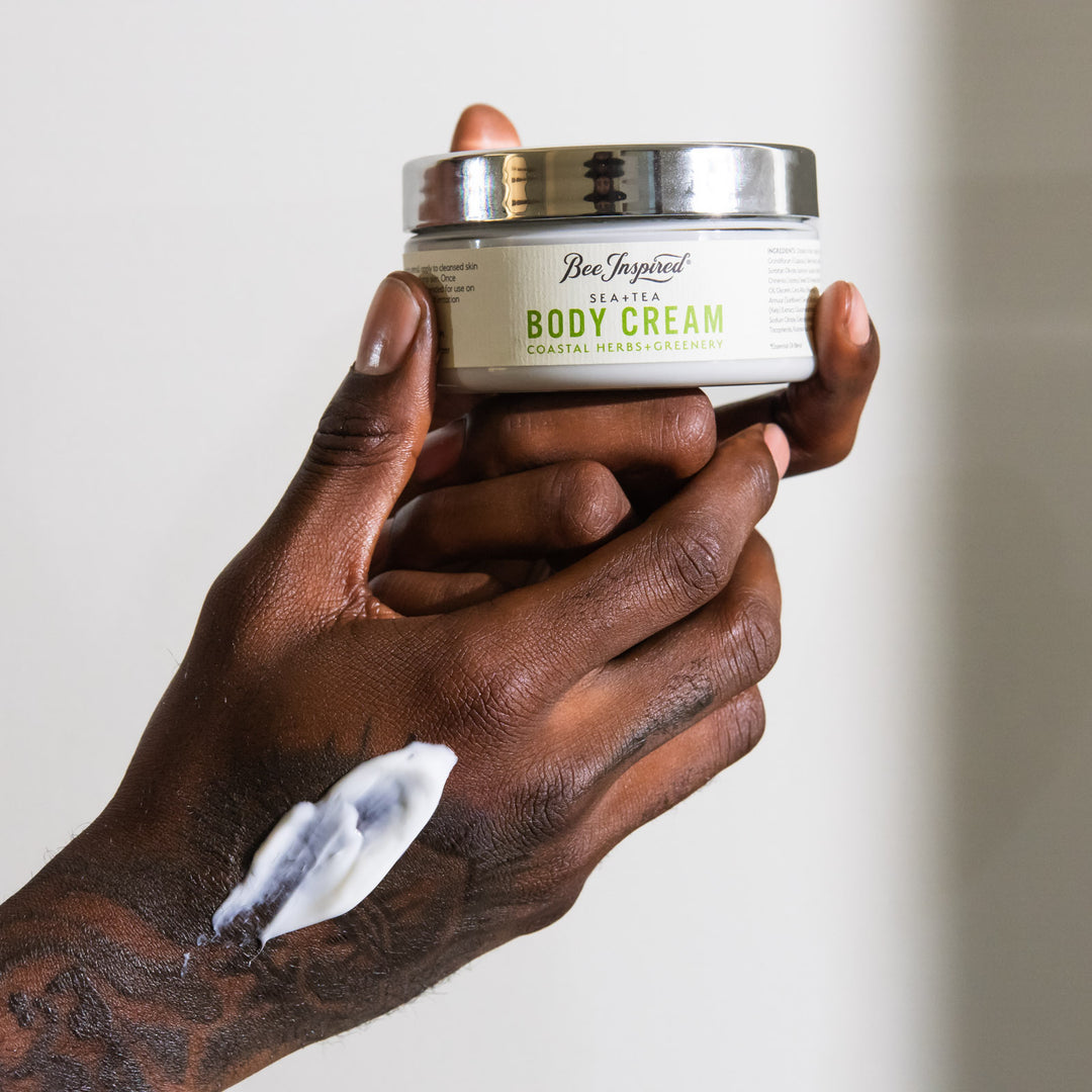 Hand holding a jar of &