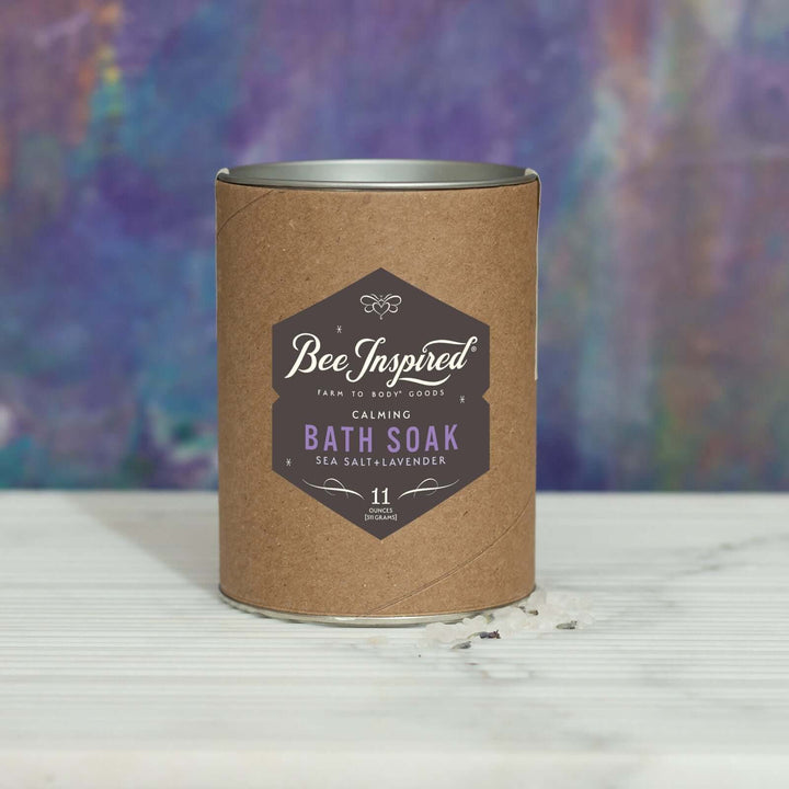 Calming bath soak in front of purple and blue art 