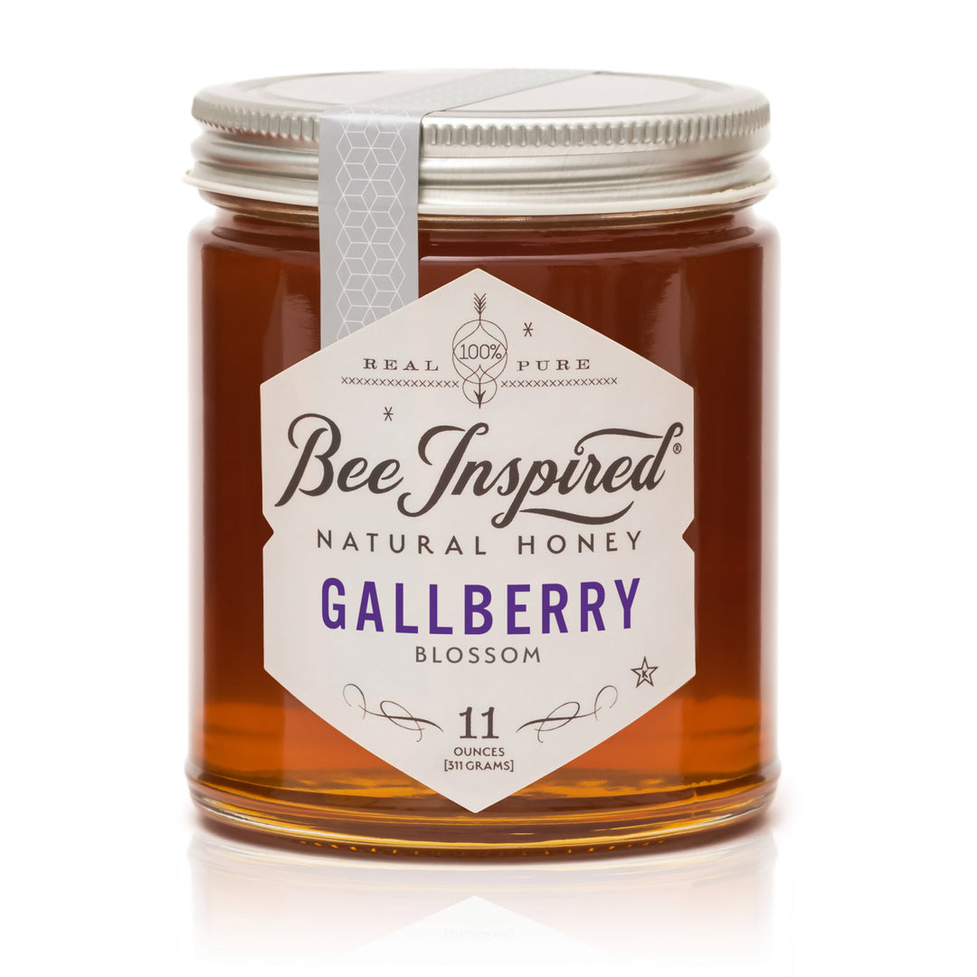 Jar of Bee Inspired Gallberry Blossom honey on a white background
