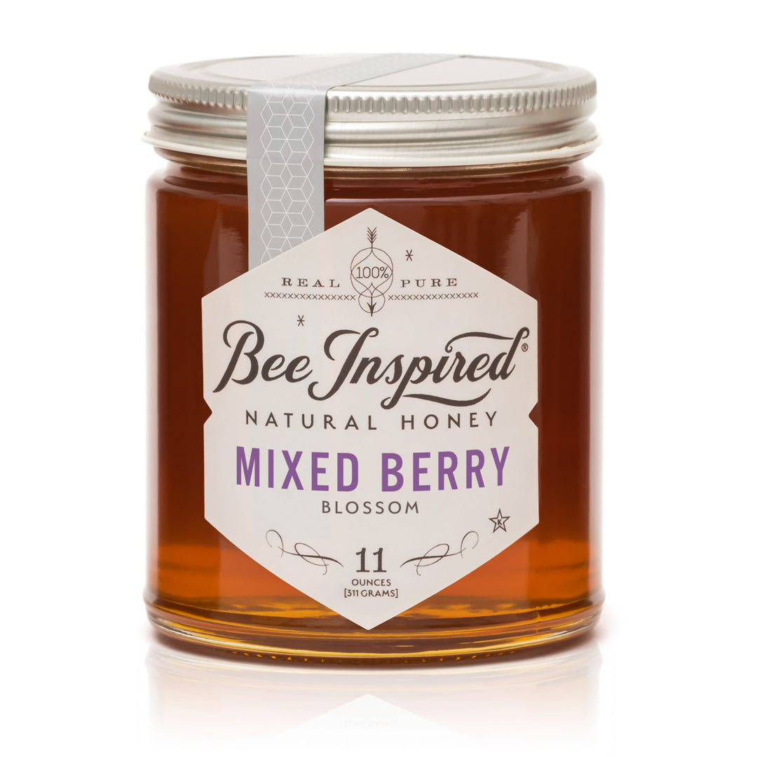Jar of Bee Inspired Mixed Berry Blossom honey on a white background
