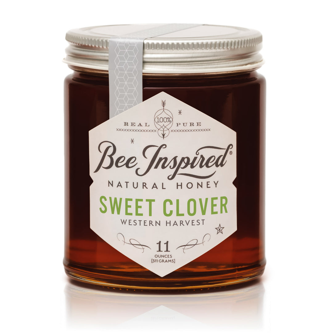Jar of Bee Inspired Sweet Clover honey on a white background