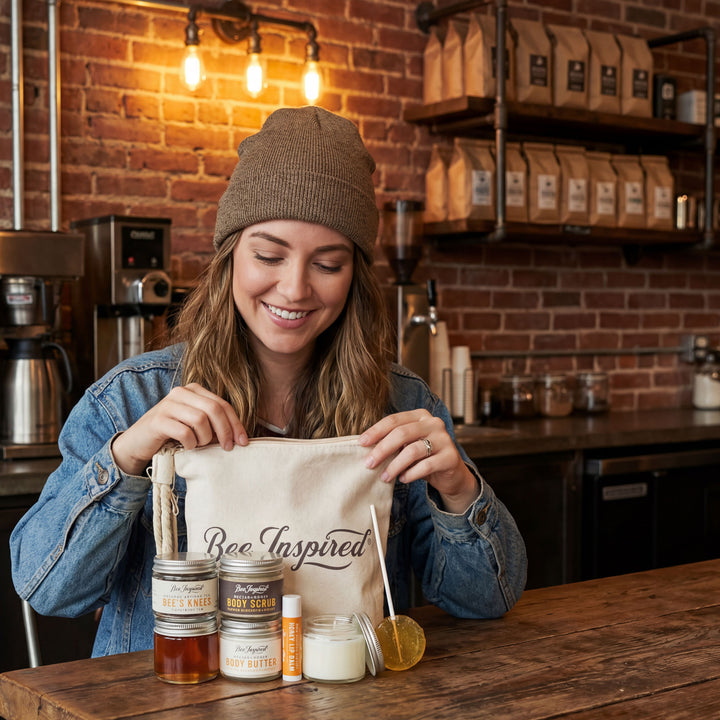 Woman in a coffee shop holding a tote bag with &
