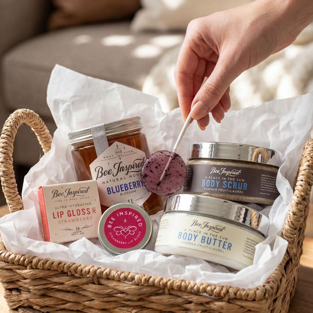 Basket of Bee Inspired skincare products with a hand reaching in.