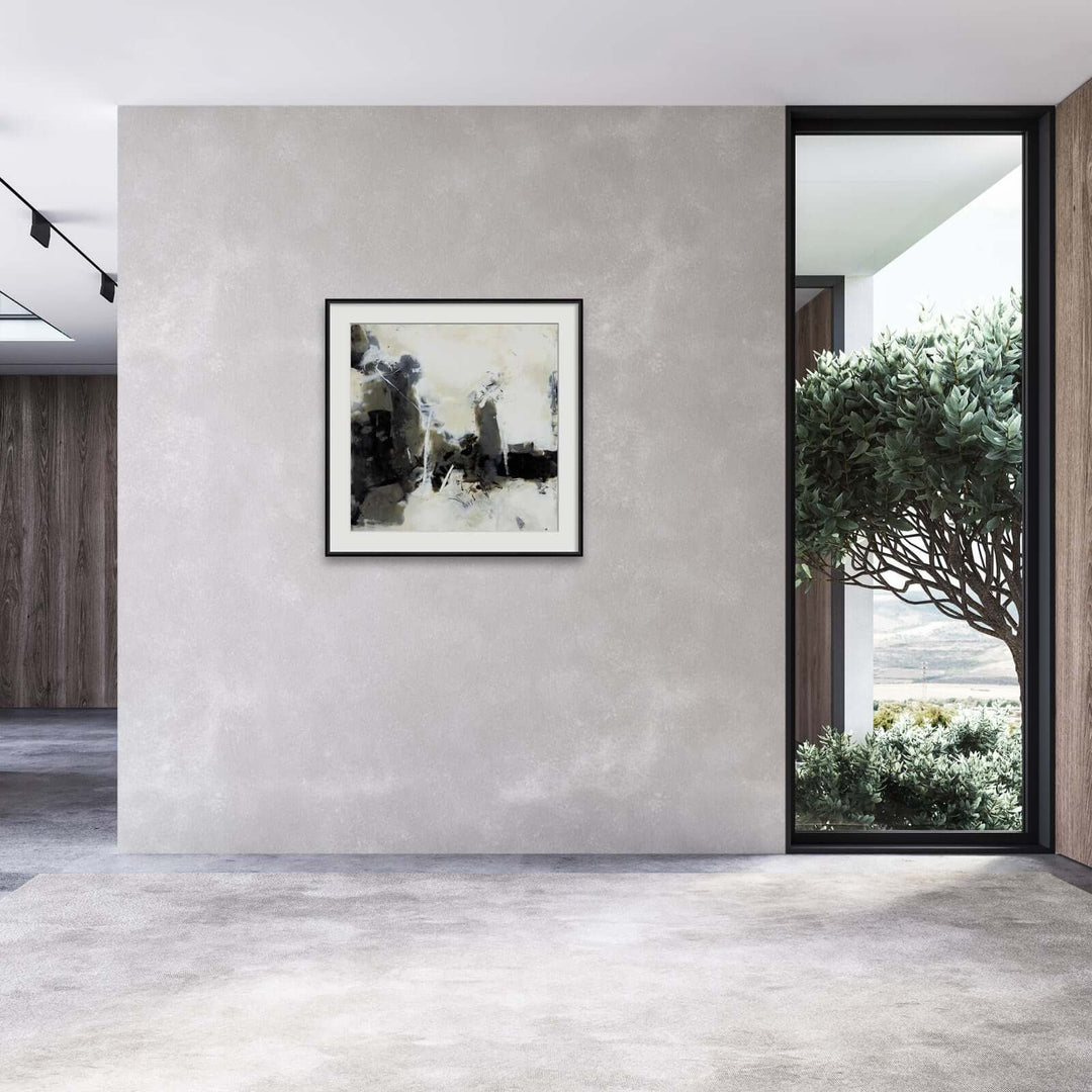 Living room with black and white painting on the wall 