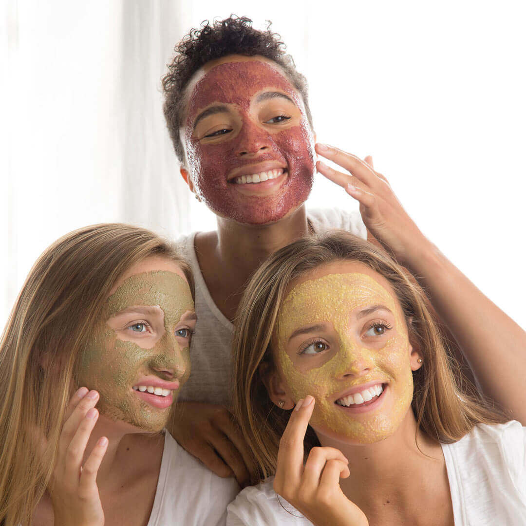 A group of friends with face masks on 