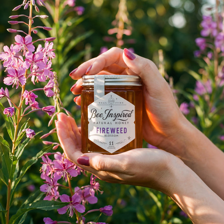 Hand holding a jar of &