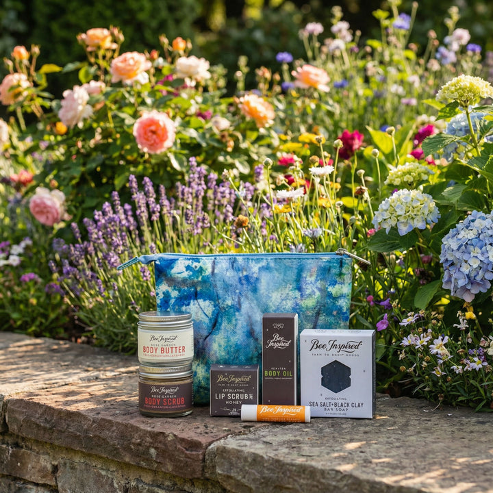Cosmetic products on a stone ledge with a garden background