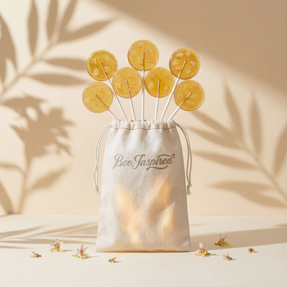 Bowl of honeycomb on sticks with 'Bee Inspired' text against a neutral background