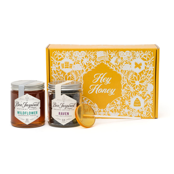 Two jars of honey with a decorative box labeled &