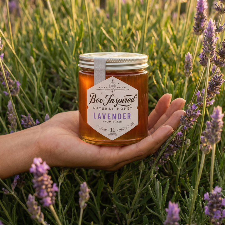 Hand holding a jar of &