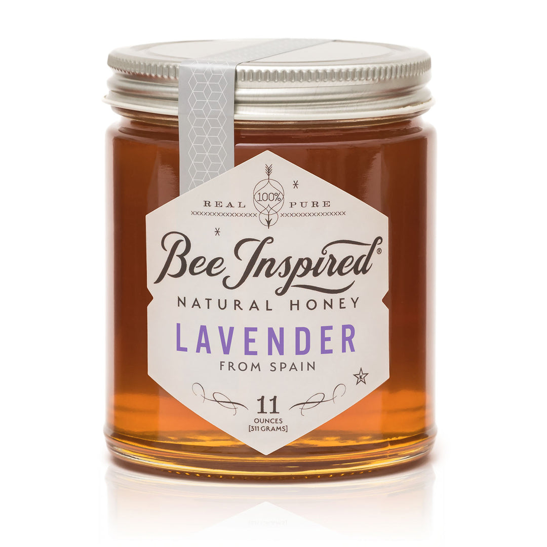 Jar of Bee Inspired Lavender honey on a white background