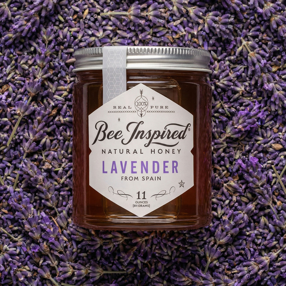 Jar of Bee Inspired Lavender honey on a bed of lavender flowers