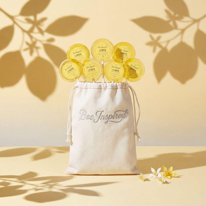 White drawstring bag labeled &