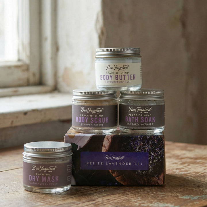 Set of Bee Inspired bath and body products on a wooden surface with a rustic background.