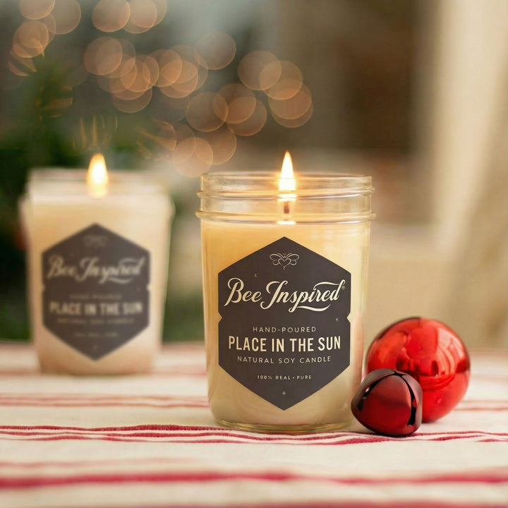 Two lit candles labeled &