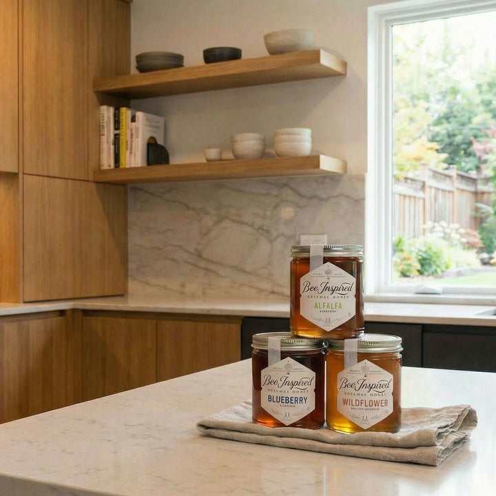 Three jars of honey labeled &