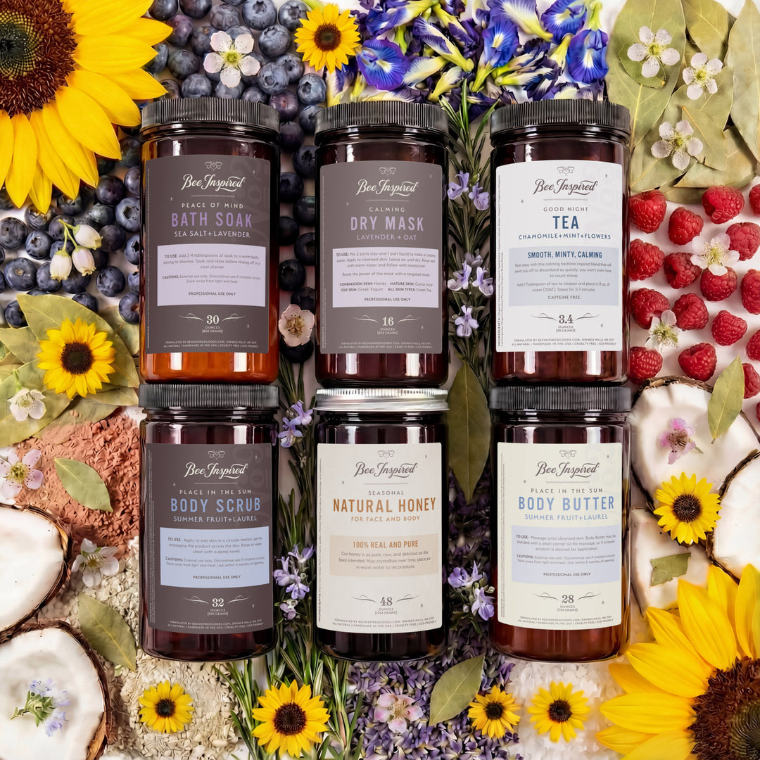 Collection of natural skincare products with floral and fruit decorations