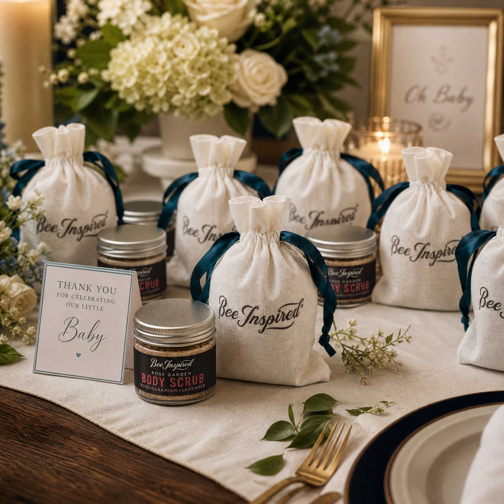 Bee-inspired products on a table with flowers and a sign.