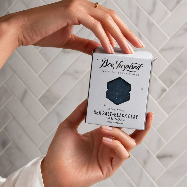 Hand holding a box of &