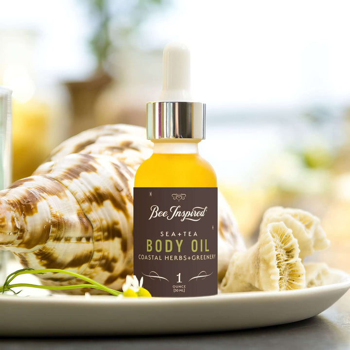 Sea+Tea body oil next to shells 