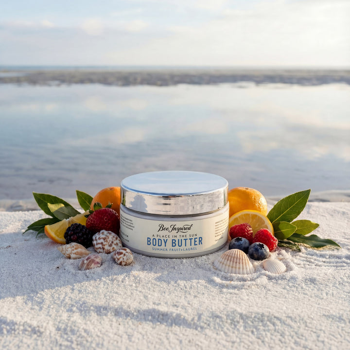 Body butter jar with fruits and leaves on a sandy beach
