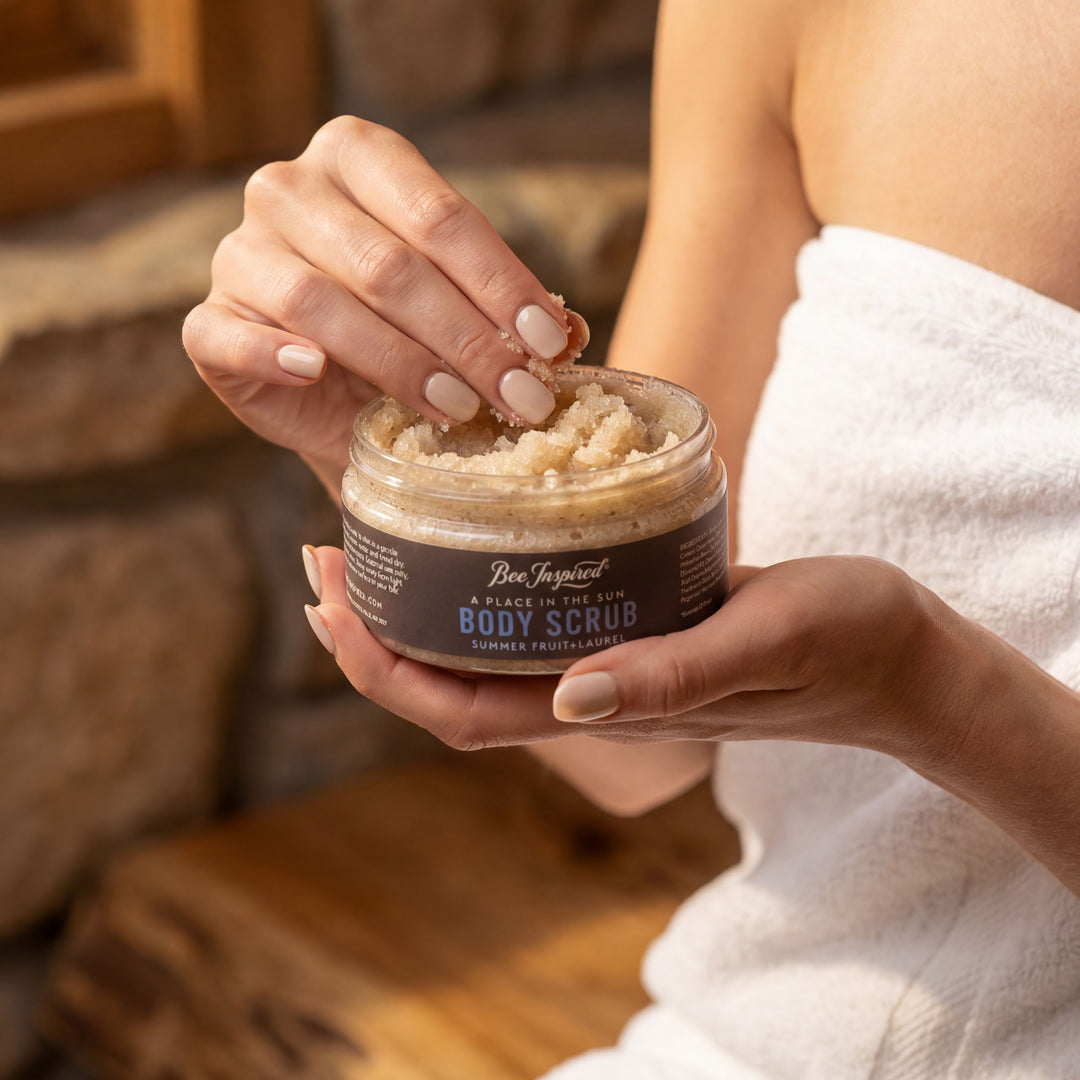 Person holding a jar of body scrub with a blurred background