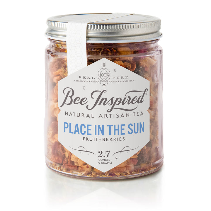 Jar of Bee Inspired Place in the Sun Fruit Tea with a white label on a white background