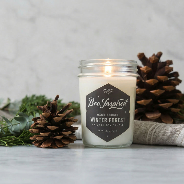 Candle in a jar labeled &